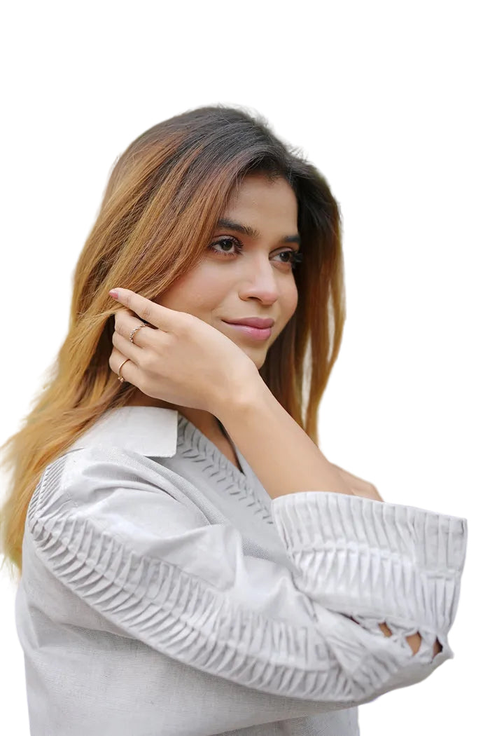 Woman wearing a light gray textured top 