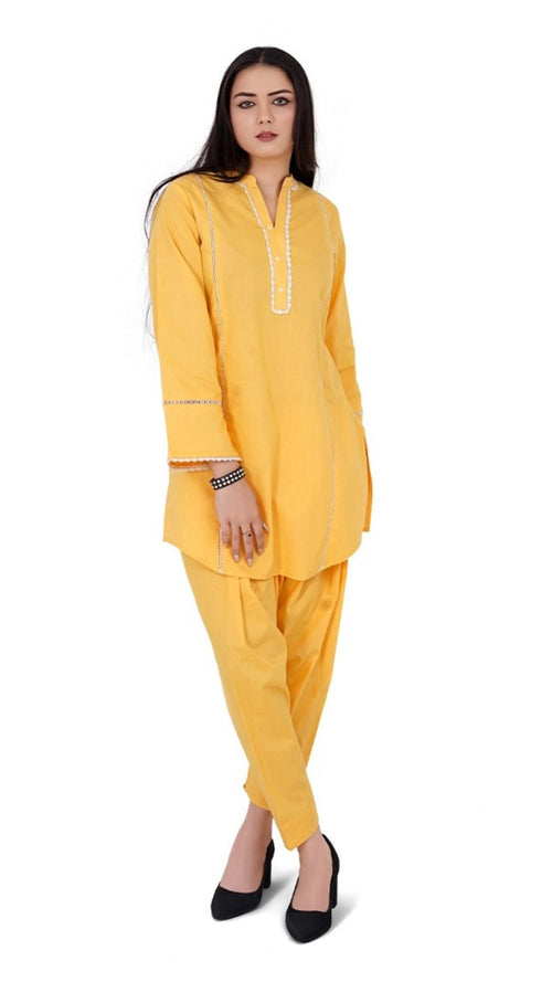 Woman wearing a yellow traditional outfit on a white background