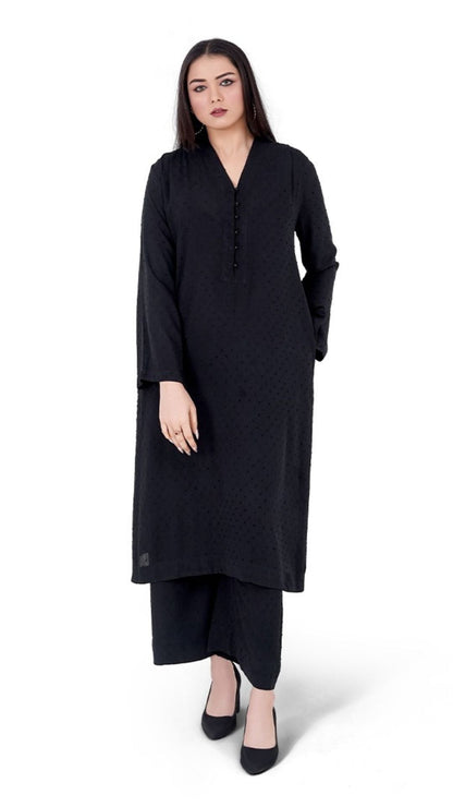 Woman wearing a black dress on a white background